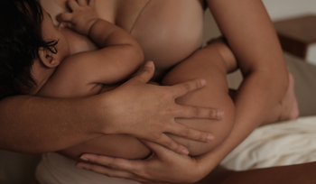 A mum breastfeeding her small baby