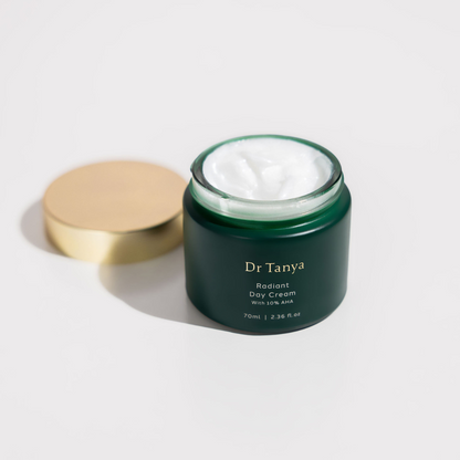 An open pot of Dr Tanya day cream showing the white product inside